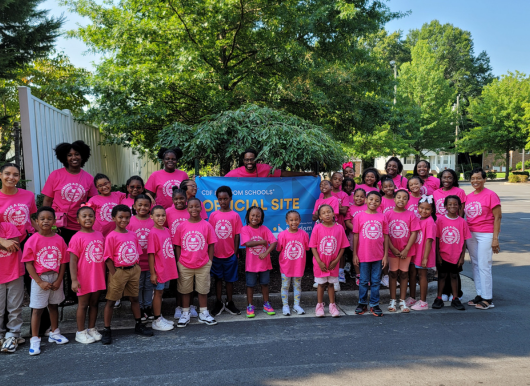 Freedom School scholars pose with Freedom School Staff outside